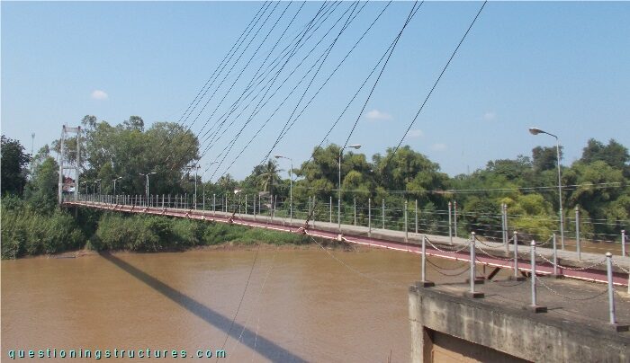Cable-stayed bridge over a river.