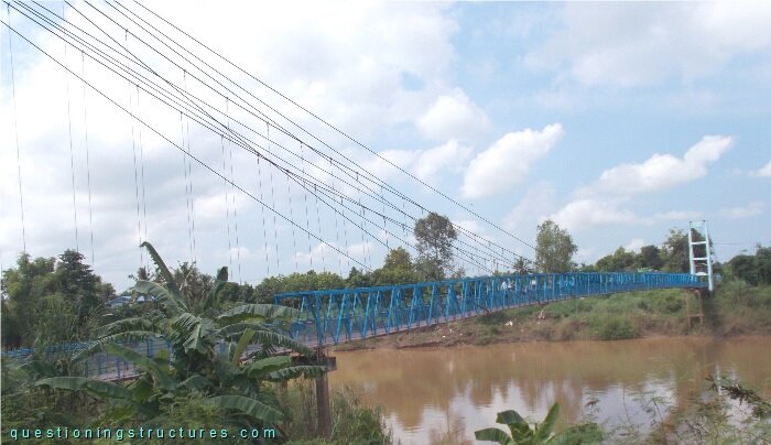 Hybrid cable-stayed suspension bridge over a river