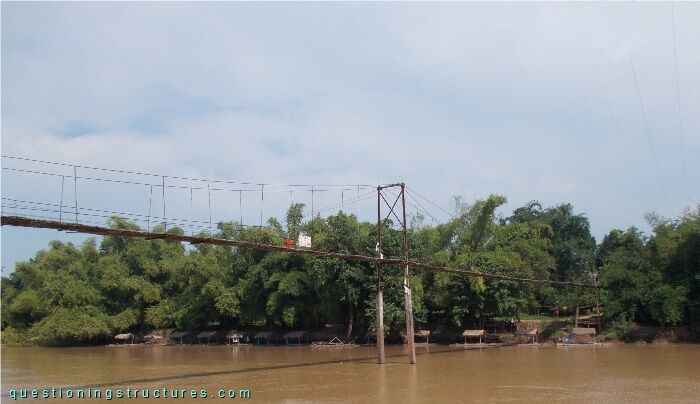  Two-span wooden suspension bridge over a river
