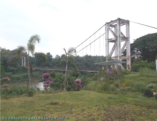 Suspension bridge with truss pylons over a river (link-image to suspension bridge 5)