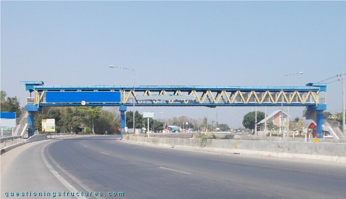 Steel truss bridge over a highway
