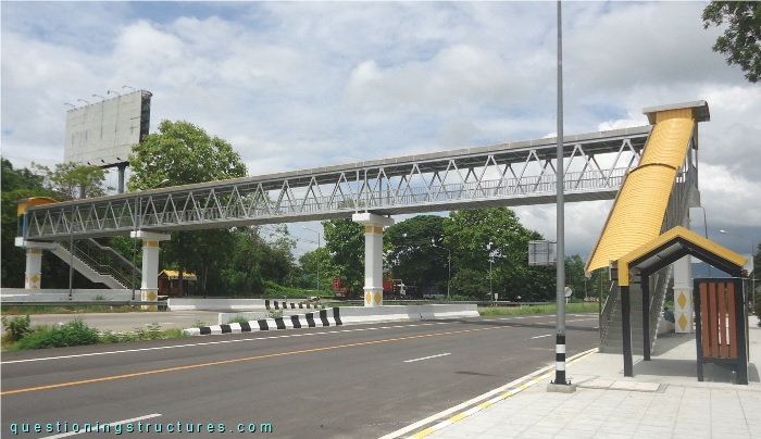 Through-truss bridge over a highway.
