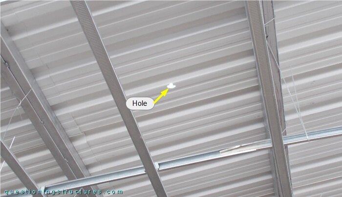  Metal roofing sheet with a hole