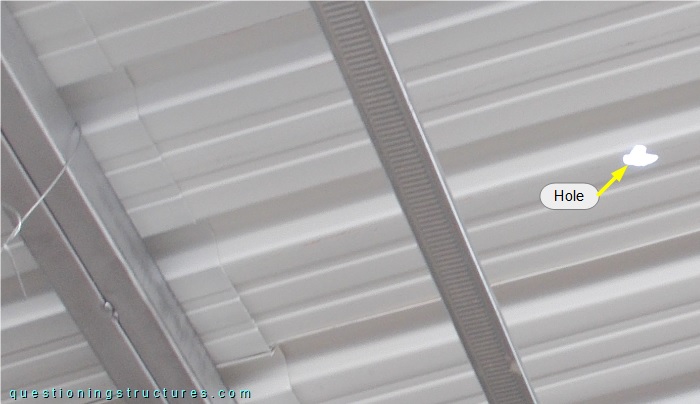 Holed metal roofing sheet