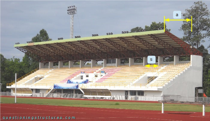 Covered grandstand with tapered steel trusses