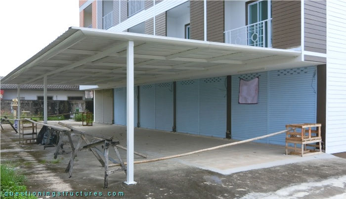 Steel canopy with front columns.