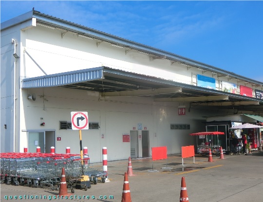 Steel canopy roof with double-tapered I-beams, suspension rods, and fly braces (link-image to canopy roof 15).