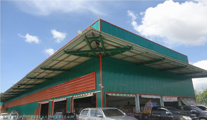 Industrial steel canopy roof carring a billboard structure.