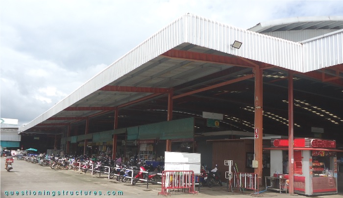 Steel canopy roof with trapezoidal corrugated web beams (TCWB).